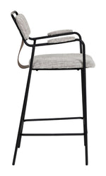 Bar stool with black metal frame and gray cushioned seat