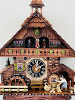 Cuckoo Clock Cottage with Waterwheel and Moving Woodchopper 18.5 Inch Height By River City Clocks