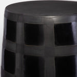 Compact round garden stool in black earthenware