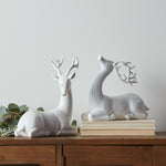 white deer sculptures