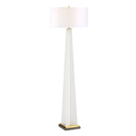 Tall floor lamp with a white shade on a white background