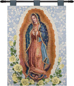 Tapestry of Our Lady of Guadalupe with floral design on a blue background