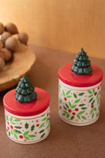 Two small round ceramic containers with lids