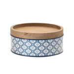 Iron canisters with natural wood lids on countertop