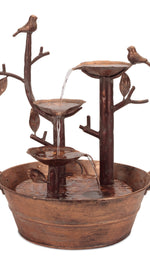 Bronze outdoor fountain with birds and branches on a white background