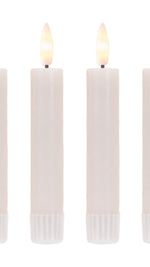 Battery-operated faux flame candles in a cozy living room setting