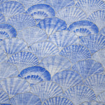 Pattern of blue and gray fan shapes on a textured background