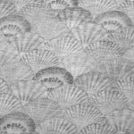 Pattern of gray scallop shells on a textured background