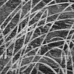 Close-up of a textured black and white patterned rug