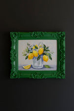 Dark green framed acrylic painting of lemons