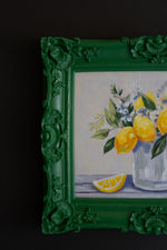 Green framed kitchen wall décor with lemons