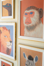 Large and small framed animal prints
