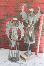 Set of two metal Christmas angels on mantel