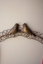 Rustic metal holiday wreath with bird accents