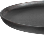 Black ceramic plate on a white background