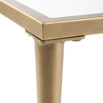 Close-up of a gold table leg on a white background