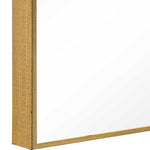 Close-up of a wooden picture frame corner on a white background