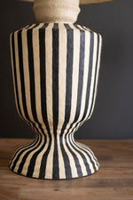Artistic black and white lamp with drum shade