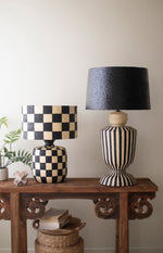 Black and white paper mache table lamp with black shade