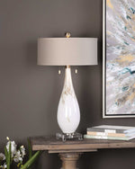 Chic Uttermost white glass table lamps offering ambient room lighting