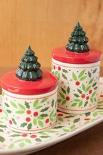Two small round ceramic canisters with Christmas holly and berry pattern