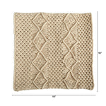 Beige textured throw blanket with diamond pattern on a white background
