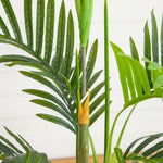 Artificial tropical palm in a white round planter for office décor