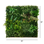 Square artificial green wall panel with layered faux foliage, ferns, succulents, and small white flowers, shown on a white background with dimension markers indicating 38 inches by 38 inches.