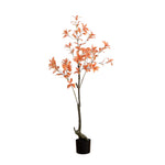 Potted artificial tree with orange leaves on a white background