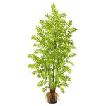 Artificial potted plant with green leaves on a white background