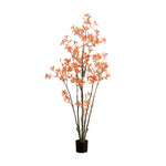 Artificial orange flowering plant in a pot on a white background