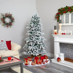 Living room decorated for Christmas with a tree, presents, and festive decor.