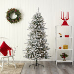 Frosted Christmas tree in a room with a wreath, chair, and decorative items.