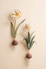 Painted metal floral wall sconces designed to hold taper candles