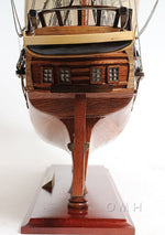 Wooden model ship on a white background