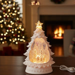 LED pine tree–shaped winter snow globe