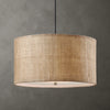 Textured beige pendant light against a gray background