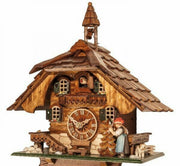 Black Forest cuckoo clock – lady pulls rope to ring bell at the top of every hour