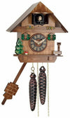 Hand-carved cuckoo clock with tree, mushroom, water pump, and cottage design