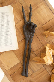 Skeleton arm peace gesture seasonal decor