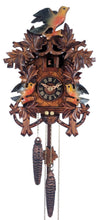 Light painted cuckoo clock with three birds, eight maple leaves, and nest