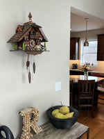 Chalet-Style Cuckoo Clock 13-Inch with Woman & Beer Drinker Animation by River City Clocks