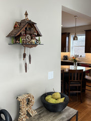 Chalet-Style Cuckoo Clock 13-Inch with Woman & Beer Drinker Animation by River City Clocks