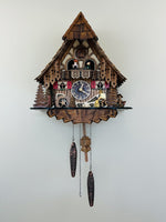Quartz cuckoo clock 14 inch cottage design with animated woodchopper By River City Clocks