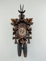 Eight Day Hunter's Cuckoo Clock – 15 in Hand-carved Maple Leaves & Rifles – Traditional Design By River City Clocks