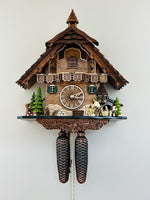 Eight Day Cuckoo Clock – 13 in Height – Cottage Turret with Animated Man Chopping Wood – By River City Clocks