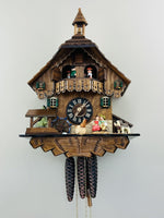One Day Musical Cuckoo Clock – 14 in – Cottage Boy and Girl Kiss with Waterwheel – River City Clocks