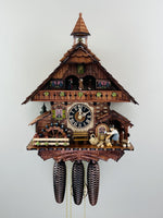 Eight Day Musical Cuckoo Clock Cottage with Moving Woodchopper 18.5 Inch Height and Waterwheel By River City Clocks