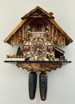 Eight Day Cuckoo Clock – 13.5 in Height – Chalet Volksmarcher with Moving Walker Design – By River City Clocks