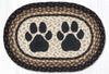 "Farmhouse style oval placemat with black dog paw print braided jute"